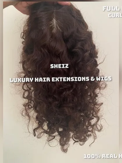 We create hair systems in any texture, as shown with this curly full wig. This piece is made from 100% real hair, offering a vibrant, natural curl pattern for a complete and authentic look.