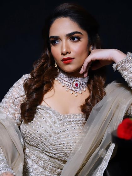 A classic portrait with a red lip. This look is all about confidence and old-school glamour.