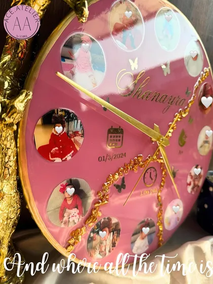 A close-up detail shot of the personalized baby clock, showing the tiny photos and custom text that make it so special.