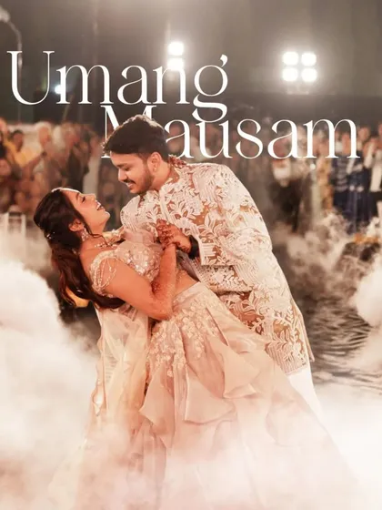 A dreamy dance shot, capturing the couple lost in their own world. The low smoke effect adds a touch of magic and romance.