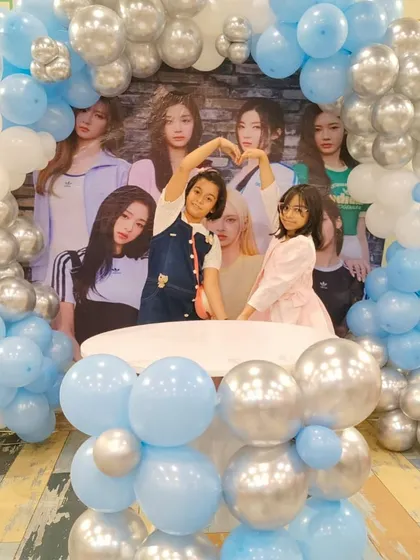 Making a heart sign with friends. These fun, candid shots perfectly capture the spirit of friendship and celebration.