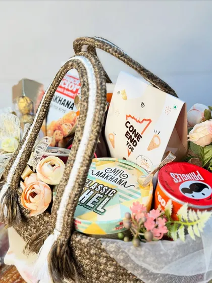 These goodie baskets are perfect as wedding return favors or room hampers for your guests. Filled with snacks and treats, and packed in a stylish and reusable jute bag, they are a warm and welcoming gesture.