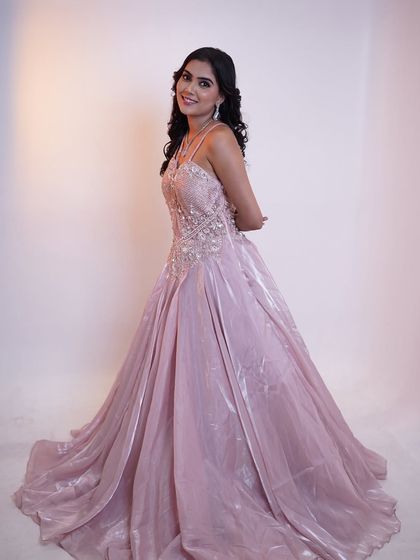 Step into a storybook fantasy with this enchanting pink tale gown. The makeup is soft and dreamy to match.