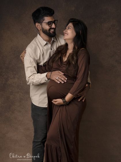 A classic portrait filled with warmth and affection. Their happy expressions show the excitement of starting their family journey together.