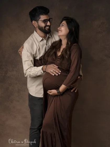 A classic portrait filled with warmth and affection. Their happy expressions show the excitement of starting their family journey together.