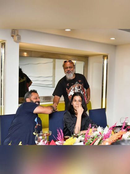 A candid moment of conversation and connection between guests at our exclusive dining event. We foster a sense of community around our shared love for food.