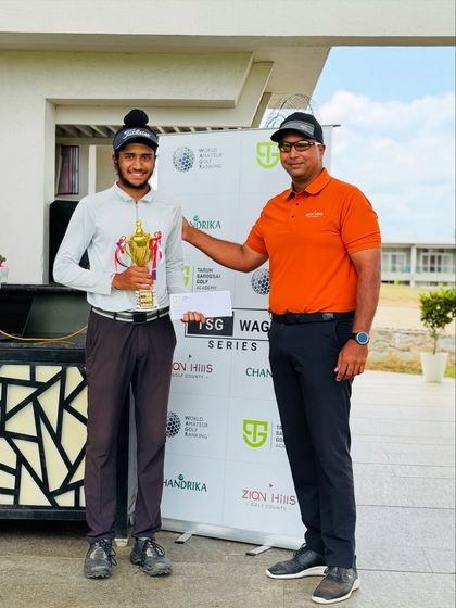 A champion holding his trophy. These moments are a culmination of countless hours of disciplined practice and hard work.