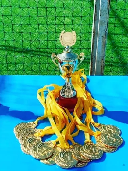 The spoils of victory. A close-up of the trophies and medals our archers competed for and won, representing countless hours of practice and dedication.