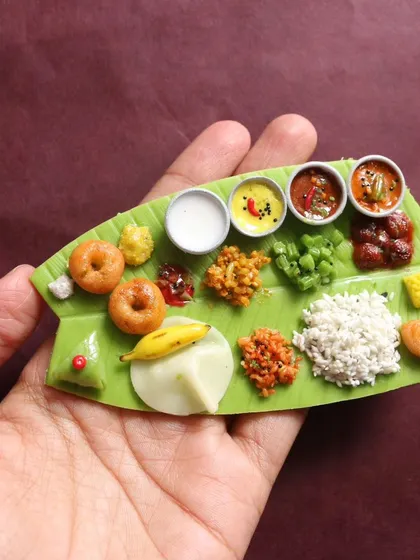 This is a complete Andhra-style meal, served on a miniature banana leaf. In my courses, I teach you how to create every single element, from the perfectly textured rice and tiny vada to the different curries and pickles, making it a true feast for the eyes.