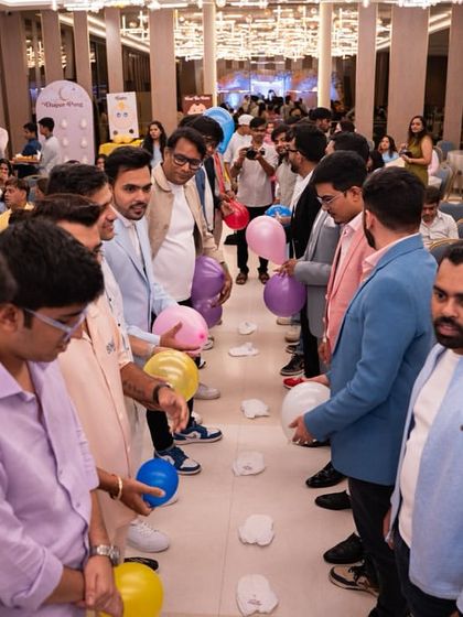 A balloon-popping game in full swing. The energy and excitement during these activities are absolutely contagious.