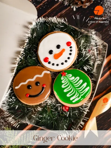 Christmas is incomplete without cookies. This festive box contains hand-decorated ginger cookies shaped like a snowman, a gingerbread man, and a Christmas tree.