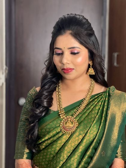 A close-up of Rakhi's engagement makeup, showing the shimmery pink eyeshadow and flawless base.