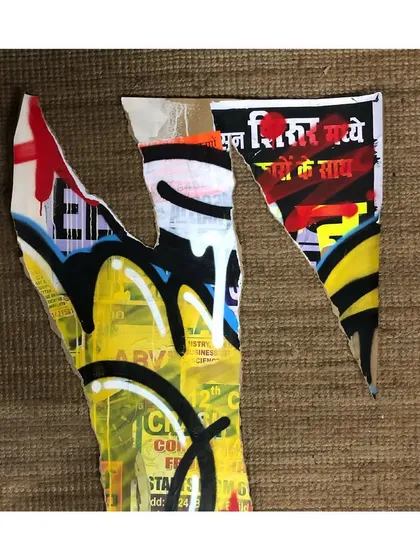 A detail shot of a deconstructed décollage piece. You can see the raw, torn edges of the canvas and the interplay between Hindi script from a poster and my abstract graffiti marks.