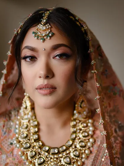 A classic bridal portrait that focuses on the intricate details of the bride's attire and her calm, confident expression. I use soft, natural light to highlight features and create a timeless, high-end look that still feels completely authentic to you.