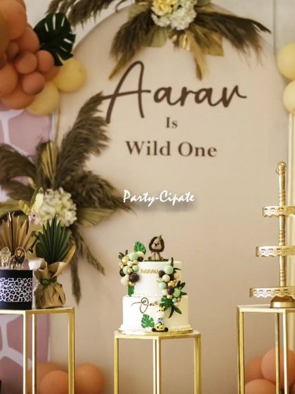 A close-up of the elegant cake and dessert stands for the modern safari theme, showing how the 'Wild One' concept can be both stylish and fun.
