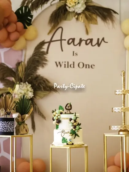 A close-up of the elegant cake and dessert stands for the modern safari theme, showing how the 'Wild One' concept can be both stylish and fun.