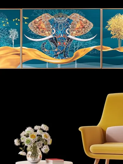 The Udaipur Elephant is captured in this magnificent three-panel crystal glass painting. The central panel features the majestic elephant, while the side panels depict serene trees, all tied together with a flowing golden ribbon design.