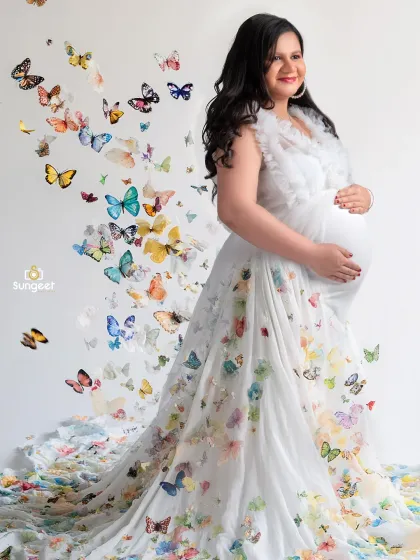 Another beautiful take on our butterfly theme, this time with a white gown and a rainbow of colorful butterflies that seem to emerge from the dress itself.