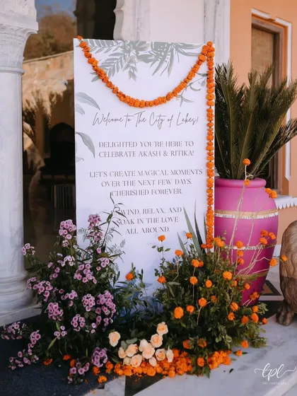 The welcome sign for a wedding in Udaipur, the "City of Lakes." Framed with marigolds and fresh greenery, it set a warm and inviting tone, welcoming guests to a few days of magical moments.