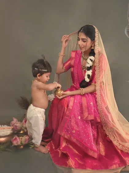 A playful interaction between mother and child. This candid moment captures the curiosity of a baby exploring the props, adding a layer of authenticity to the themed portrait.
