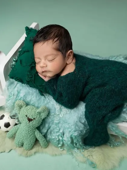 A future all star at rest. This baby is styled with a miniature baseball bat, ball, and soccer ball, showing a variety of sports themes we can explore in a single session.