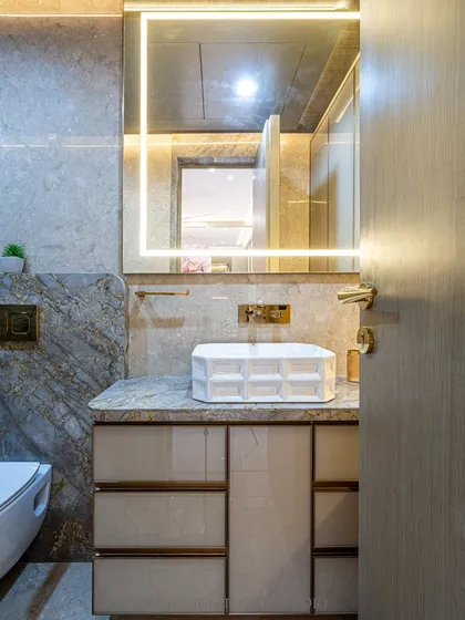 This shot highlights the elegant vanity with its custom drawers and the beautiful marble countertop. The design is a perfect blend of style and functionality.
