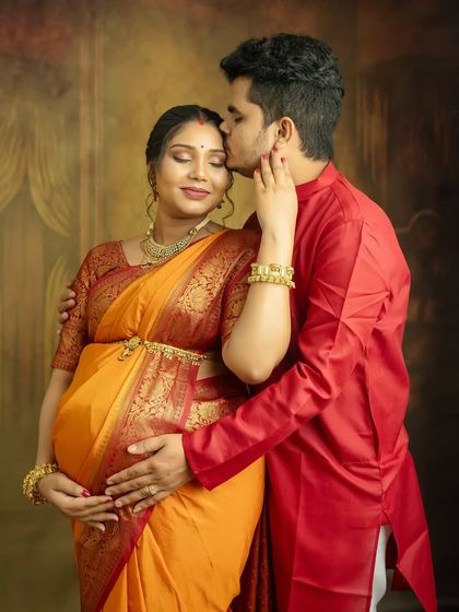 A gentle kiss on the forehead is a timeless expression of love and protection. This pose creates a deeply emotional and beautiful memory for you both.
