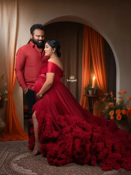 A passionate and romantic couple's portrait. The warm, candlelit Moroccan theme and matching red outfits create a dramatic and intimate feel.
