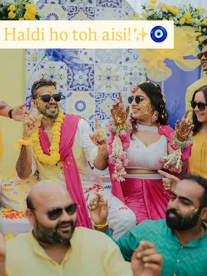 "Haldi ho toh aisi!" A perfect group shot capturing the fun, energy, and love of friends and family celebrating the happy couple during their Haldi ceremony.