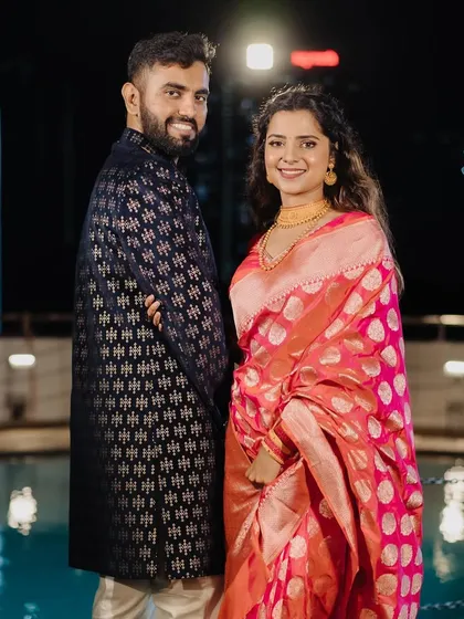 They made it! A happy couple at their engagement celebration. The bride's makeup is radiant and joyful.