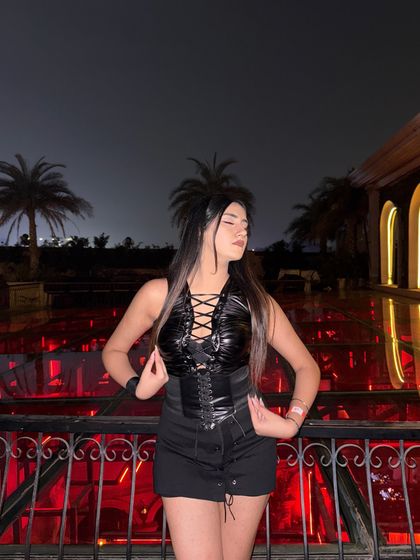 My Halloween look. A black faux leather top, corset belt, skort, and knee-high boots for a Catwoman/vampire vibe.