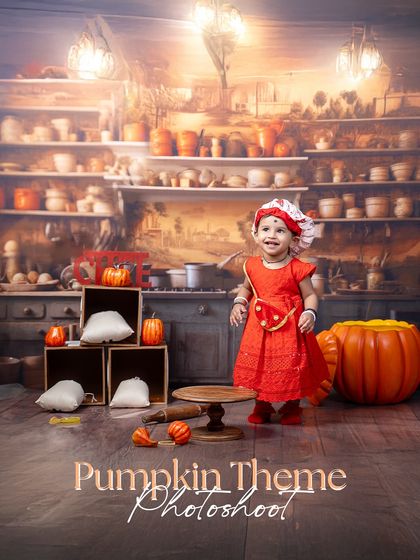 A pumpkin-themed photoshoot is perfect for the autumn season. This little chef is ready to cook up something delicious in her cozy, rustic kitchen.