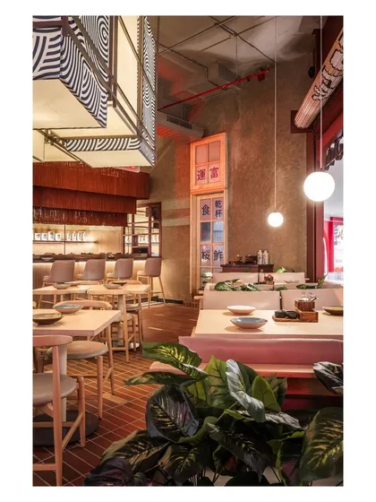 The deep red of the facade acts as a frame, creating visual interest from the mall corridor and inviting people to experience the unique vibe of Lucky Chan.