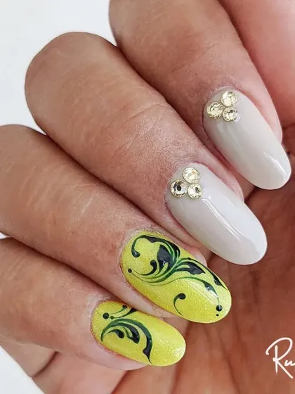 A full hand view of the neon swirl design with crystal accents.