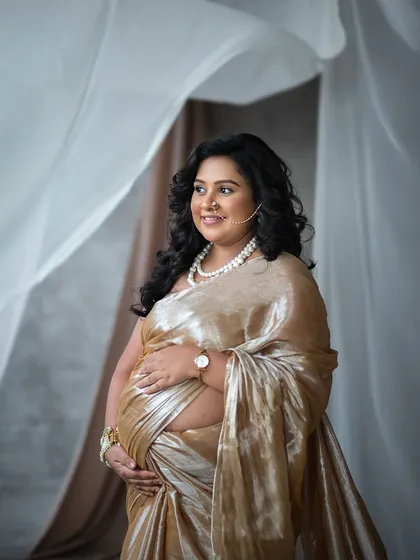 A saree is not just fabric; it’s a story of heritage and grace. I believe in weaving your traditions into your maternity portraits, creating timeless images that feel deeply and authentically you.