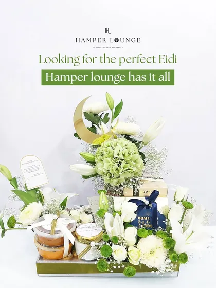 Eid celebrations deserve a touch of grandeur. This hamper, overflowing with fresh white and green florals and festive treats, is arranged in a beautiful tray and accented with a golden crescent moon to make your Eidi truly special.