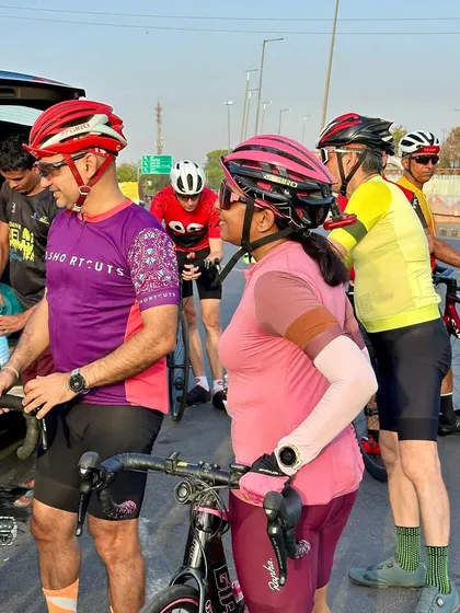Members getting ready for a ride, checking their gear and hydration.