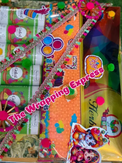 This Holi hamper is all about colors, packed with multiple cans of herbal gulal and other festive goodies.