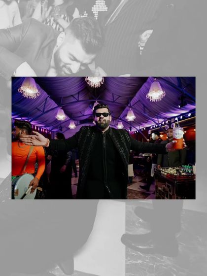 The groom, Saurav, enjoying his cocktail night in style. The custom black outfit with subtle embellishments is perfect for a party atmosphere.