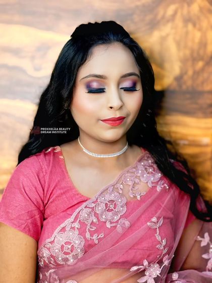 Glam, giggles, and glitter. This party look features a fun pink and purple eyeshadow combination, perfect for a night out with friends or a festive celebration.