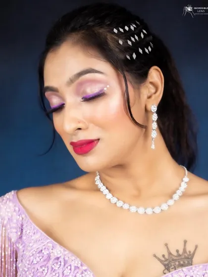 Another detailed shot of the eye makeup. I used a sharp, floating glitter liner in a vibrant purple to add a modern, graphic element to this otherwise soft and romantic look.