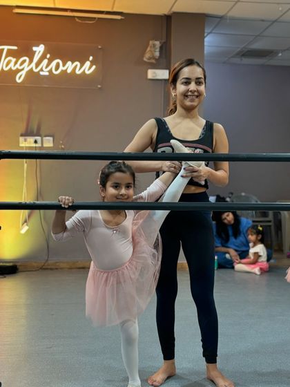 Stretching at the barre is a fundamental part of every ballet class. I love guiding my students as they build the flexibility and strength needed for graceful movements.