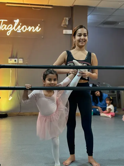 Stretching at the barre is a fundamental part of every ballet class. I love guiding my students as they build the flexibility and strength needed for graceful movements.