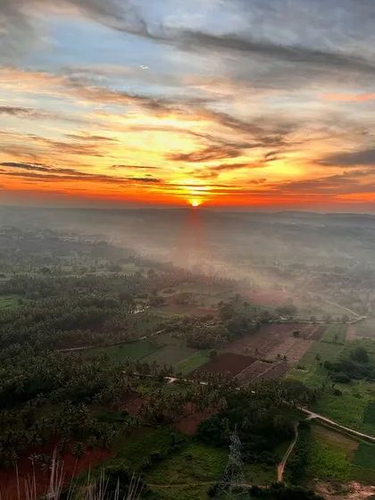 The beautiful sunrise view over the Thonnur lake from the Kunti Betta peak.