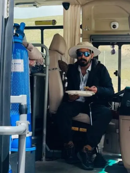 Taking a meal break inside our travel bus. I handle the logistics so that you can remain focused on your inner experience throughout the yatra.