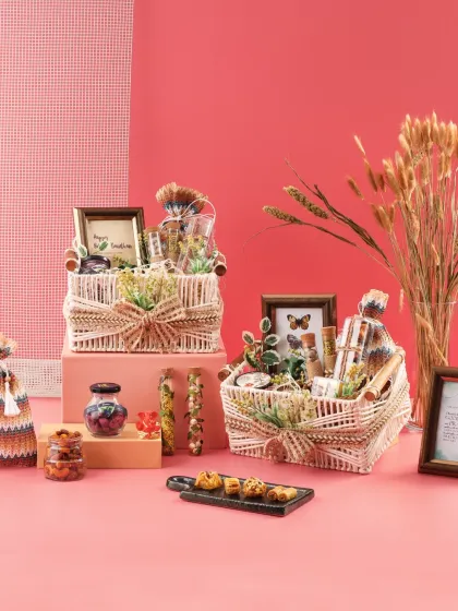 Our rustic Rakhi hampers are a blend of tradition and charm. Featuring woven baskets, personalized frames, and a selection of treats, they are designed to celebrate the eternal bond of siblings.