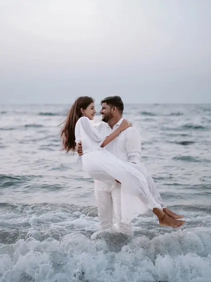 There's nothing more romantic than the ocean. This shot from a Goa pre-wedding session captures a playful and intimate moment with the waves crashing around them.