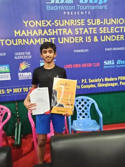 Harshit proudly displays his winner's certificate after a successful run in the state selection tournament in Pune.