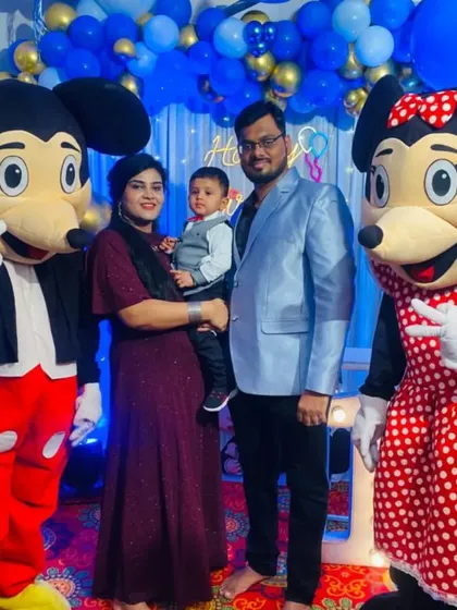 It's not just about decorations; we bring the fun too. Here, our Mickey and Minnie Mouse mascots are posing with the family, making the little one's birthday party extra special and interactive.