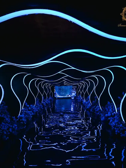 I believe an entrance should be a portal to another world. For this cosmic-themed engagement, guests journeyed through a futuristic tunnel of flowing light, a dramatic transition that prepared them for the stellar celebration that awaited.